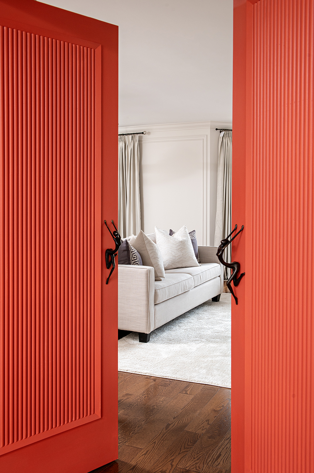 bright coral doors opening into sitting room.